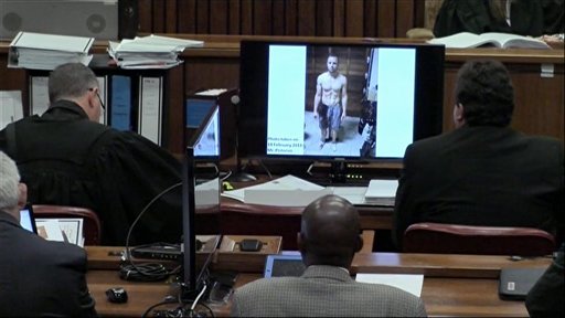 An image taken from the court pool TV showing on screen a police photograph of Oscar Pistorius standing on his blood-stained prosthetic legs and wearing shorts covered in blood, taken shortly after the athlete fatally shot his girlfriend. Photo -AP
An image taken from the court pool TV showing on screen a police photograph of Oscar Pistorius standing on his blood-stained prosthetic legs and wearing shorts covered in blood, taken shortly after the athlete fatally shot his girlfriend. Photo -AP